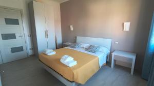 a bedroom with a bed with towels on it at Casa Michela in Sant'Agnello