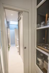 an open door to a room with a kitchen at Studio Royan in Royan