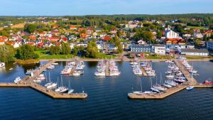 an aerial view of a harbor with boats in the water at Marina Apartamenty ChKŻ in Charzykowy