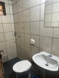 a bathroom with a toilet and a sink at Cardoso Palace Hotel Ouro Verde in Rio Verde +36 photos