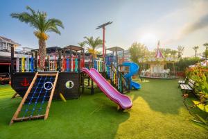 a playground with a slide in a park at Hotel Turan Prince - All Inclusive in Side