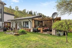 a house with a garden with a satellite at Rosenberg in Katzhütte