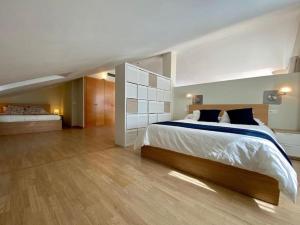 a large bedroom with a large bed in it at Exclusive Beachfront Penthouse in Almayate Alto +24 photos