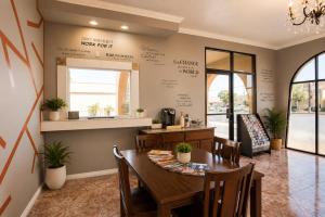 a dining room with a table and chairs at Big A Motel & Suites Near Disneyland Orange County in Orange +37 photos