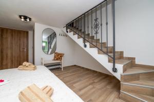 a bedroom with a bed and a staircase at Sant'Antonio in Orlec