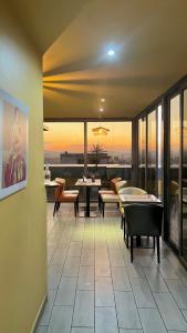 a dining room with a pool table on a balcony at Le Fred in Antananarivo