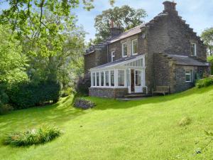 an old stone house on a grassy hill at Trevene in Buttermere