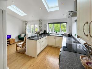 a kitchen with a sink and a counter top at Rosemary House in Broadstairs +17 photos
