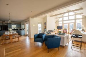 a living room with a couch and a table at Summer Lake in South Cerney