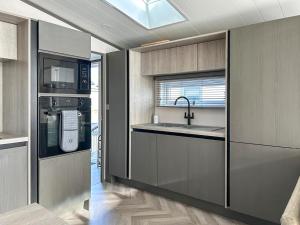 a kitchen with a sink and a stove at Marina Escape One in Peterhead
