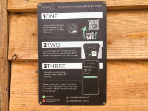 a sign is hanging on a wooden wall at Llety'r Saer in Hirnant