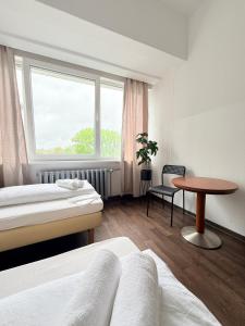 En eller flere senge i et værelse på Ootel Berlin + 62 billeder