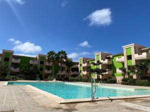 a swimming pool in front of some apartment buildings at InkHouse C02 in Santa Maria +28 photos