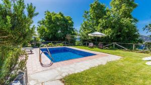 an image of a swimming pool in a yard at Cortijo Noguera La Taha - Pitres by Ruralidays in Granada