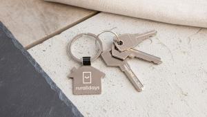 a pair of keys on a key chain at Cortijo Noguera La Taha - Pitres by Ruralidays in Granada +22 photos