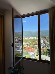 a window with a view of a city at Hotel Exclusive in Tirana
