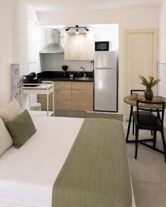 a kitchen with a large bed in a room at Casa rody in Benalmádena