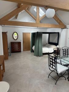a bedroom with a bed and a tv in a room at The Studio in Willerby