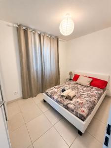 a bedroom with a bed in a room with a window at 2Bedrooms, Thèoule-sur-mer in Théoule-sur-Mer