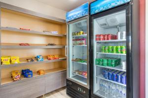 a refrigerator filled with lots of food and drinks at Baymont by Wyndham Socorro in Socorro