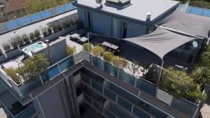 an overhead view of a building with plants on the roof at Elegance Suite Apartments - Siroli Collection in Cervia