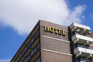 a hotel sign on the side of a building at Westlake Hotels Amsterdam in Amsterdam