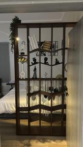 a room with a bed with a book shelf at شقق مخدومة in Jazan