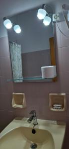 a bathroom with a sink and a mirror at Smalis Studios in Lakkíon