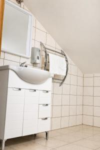 a bathroom with a sink and a mirror at Guest House Maritimo in Sukošan +93 photos