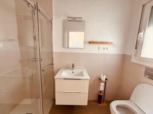 a bathroom with a sink and a shower and a toilet at Casa Damián in Ribaforada +10 photos
