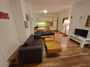 a living room with a couch and a table at Lemone in Zweibrücken
