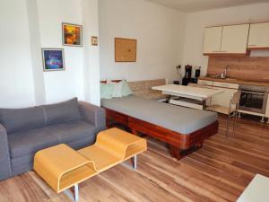 a living room with a couch and a table at Lemone in Zweibrücken