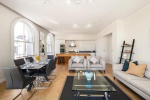 a living room with a couch and a table at Wren Urban Nest in Dublin
