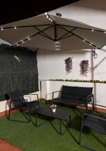 a tent with two chairs and a table in a room at El Patio de Chus by Clabao in San Javier