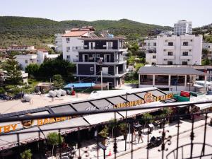 a train station in a city with buildings at Corner Hotel in Ksamil