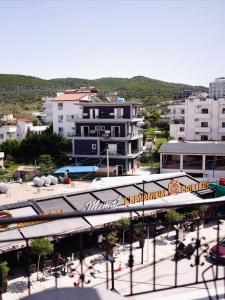 an overhead view of a city with buildings at Corner Hotel in Ksamil