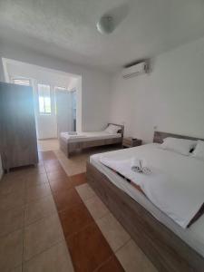 a large bedroom with two beds in a room at Apartment Chukov in Star Dojran