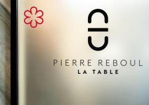 a bottle of wine with a flower on it at Renaissance Aix-en-Provence Hotel in Aix-en-Provence +105 photos