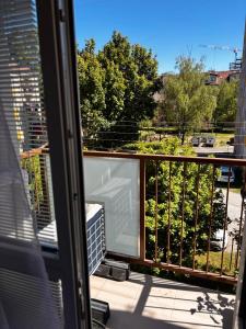 a balcony with a view of a yard at Apartmán Artemis in Košice