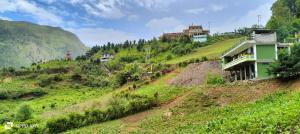 a house on the side of a hill at Nima homestay in Dirang Dzong