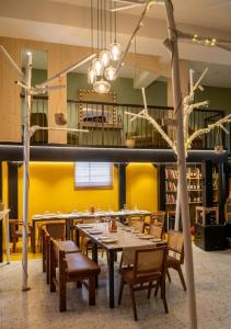 a dining room with a table and chairs at Orchard in Athens
