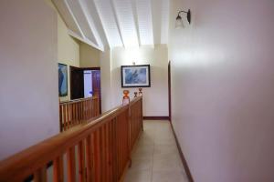 a hallway of a building with a staircase and a light at Emerald Bleu Villa in Gros Islet