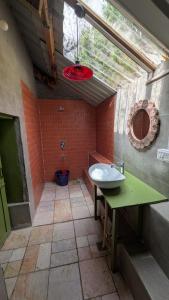 a bathroom with a sink and a toilet in it at Finding Clover in Banjār