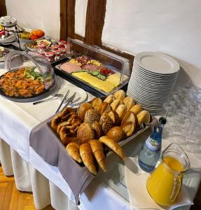 a table with a buffet of food on it at Hotel Garni BURG WALDENSTEIN in Rudersberg +21 photos