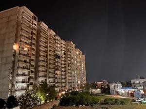 a large apartment building at night at Ophelia in Agra