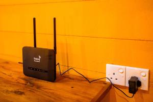 a speaker and an electrical outlet in a room at Walawa Wild Place in Udawalawe