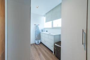 a bathroom with a white sink and a mirror at Zenith Cairo Deluxe Room Shared Apartment in Cairo +36 photos