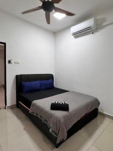 a bedroom with a bed with a ceiling fan at GR studio APARTMENT 1 - kompleks MUTIARA gua MUSANG in Gua Musang +20 photos