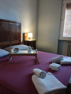 a hotel room with two beds with towels on them at Villa LUCCA in Altopascio