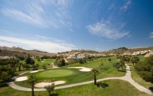 an overhead view of a golf course with palm trees at La Riviera Residence in Rojales